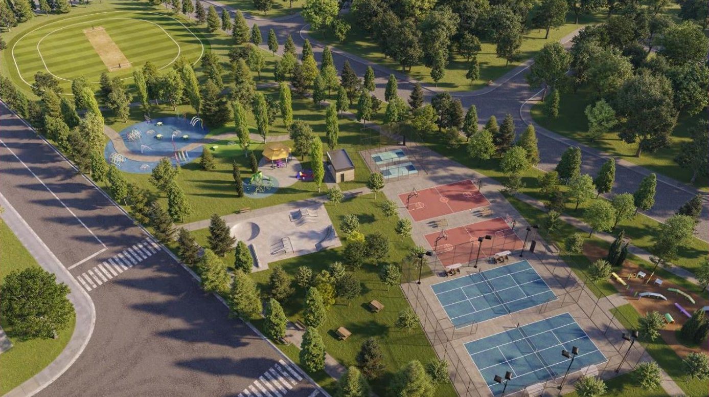 Aerial rendering of the Wildfield Village community park with courts, splash pad and cricket field